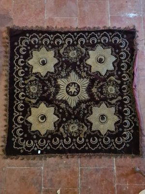 a rug on the floor with a cat laying on it