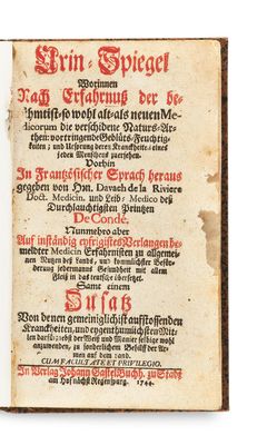 an old book with a red and black writing on it