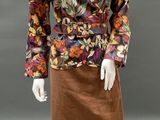 an image of a mannequin dressed in a floral print jacket and skirt