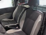 two seats in the back of a car that are black and gray