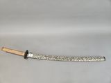 an old knife with a wooden handle on a white surface