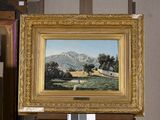 a picture of a painting on a easel in a room