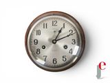 a clock that is on the wall with numbers on it