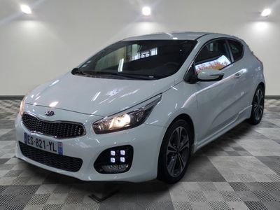 the white car is parked on a checkered floor in the garage