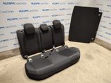 the back seats of a car are shown in front of a wall