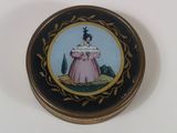 an image of a miniature picture of a woman in a pink dress