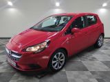 a red car parked in a garage with a checkered floor