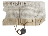 un gros plan d'une feuille de papier portant un cachet de cire
