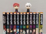 a lot of anime books stacked on top of each other