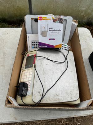 a box with a keyboard, mouse, and other electronic items in it