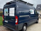 a van that is parked on the side of the road