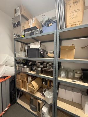a room with a lot of boxes and boxes on the shelves