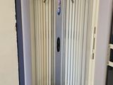 a shower in the corner of a room with a tile floor