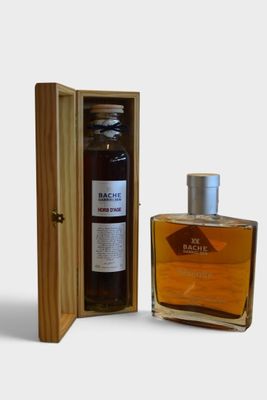 a bottle of alcohol in a wooden case