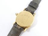 an image of a close up of a wrist watch on a white surface