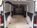a white van that is parked inside of a building