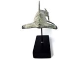 statue of a dog on a black base on a white background