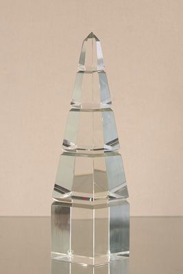 a clear glass pyramid shaped object on a table