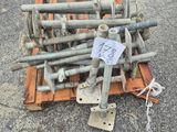 a pile of screws and bolts on a pallet on the ground