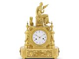 une image représentant une horloge en or sur laquelle est assis un homme