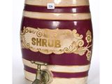 a small wooden barrel with a faucet attached to it