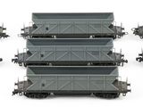 six train cars are lined up in a row on a white surface