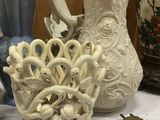 many vases that are sitting on a table