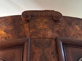a close up of a wooden door with a decorative design