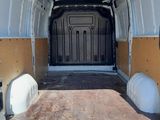 a white van with a bed in the back of it