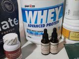 a bottle of whey next to two bottles of whey