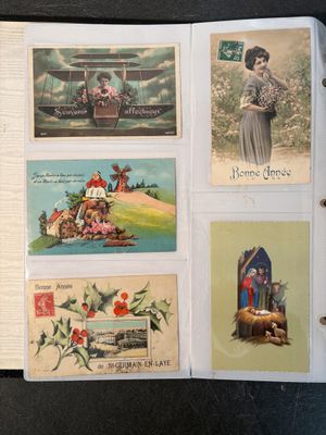a lot of old postcards on the table