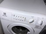 a washer and dryer in the corner of a room