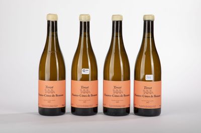 three bottles of wine sitting next to each other on a table