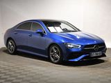 a blue mercedes cla parked in a garage