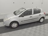 a picture of a small silver car parked in a garage