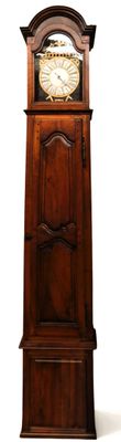 a tall wooden grandfather clock that is standing in front of a white background