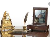 an image of a desk with a mirror and a clock