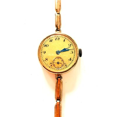 une montre-bracelet en or avec une trotteuse bleue