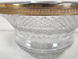 an image of a glass bowl with a gold rim on a white surface