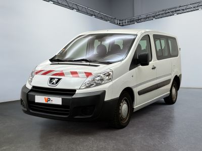 a white van with red stripes parked in a garage