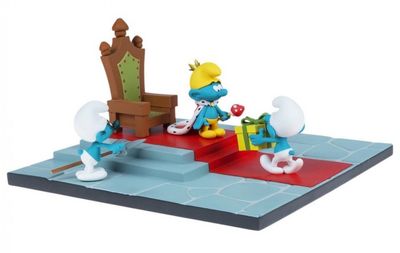 Les Schtroumpfs jouent avec leurs jouets par terre.