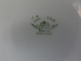 a white plate with a picture of a dog on it