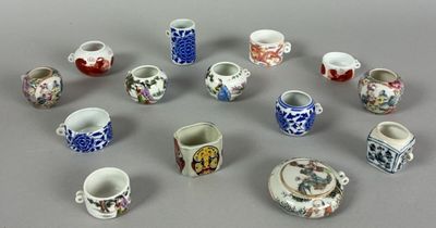 a lot of small cups and saucers on the table