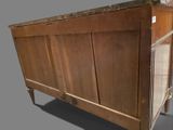a wooden cabinet with a glass door on top of it
