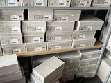 a lot of boxes that are stacked on a shelf