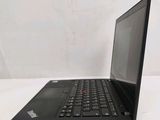 the laptop is open on a white surface with a white background