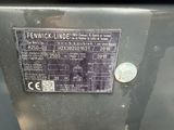 a coin sitting on top of a machine with a label on it