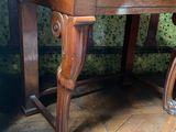 a wooden table with a mirror on top of it