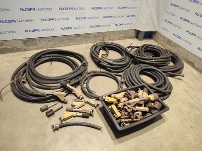 a lot of hoses and other tools on the floor