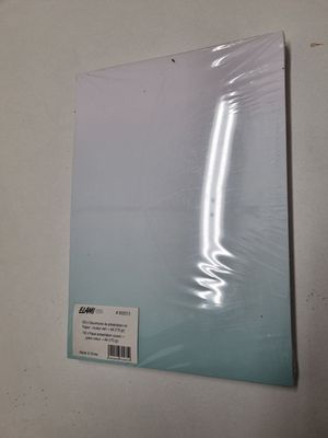 a close up of a piece of paper on a wall
